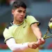 Carlos Alcaraz advances at the Madrid Open on Sunday.